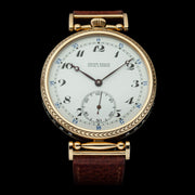 Exceptional artisan wristwatch boasts a vintage mechanical movement with an original enamel dial housed in the handcrafted engraved case